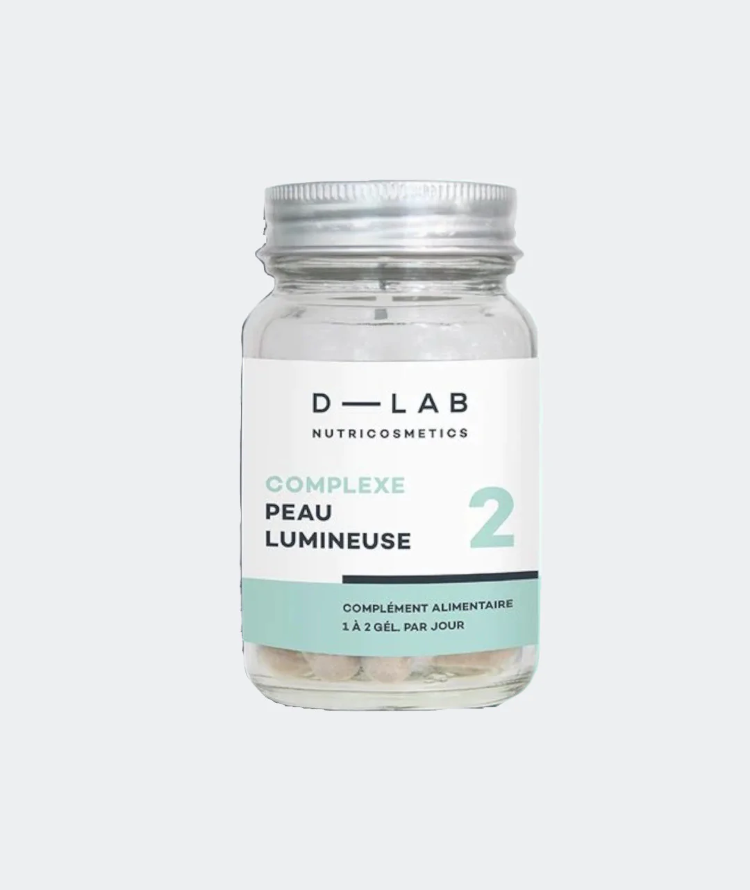 Skin Glowing Complex 28 capsules on gray background.